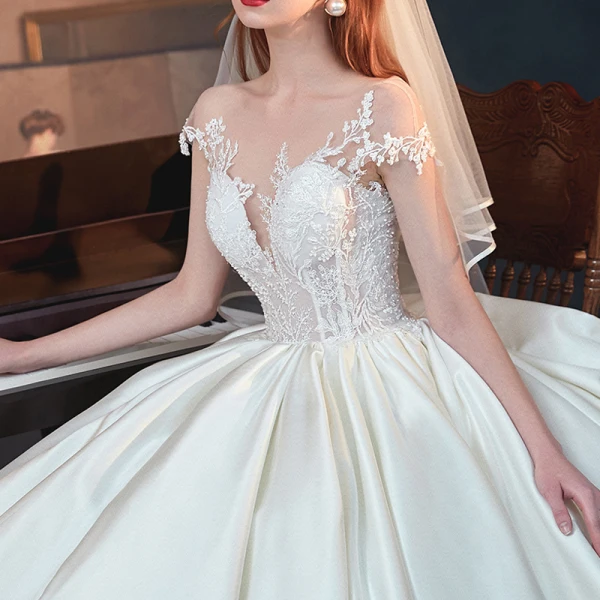 Illusion Ivory Satin See-through Bridal Wedding Dresses 2020 Ball Gown Scoop Neck Short Sleeve Backless Appliques Lace Beading Chapel Train Ruffle