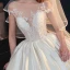 Illusion Ivory Satin See-through Bridal Wedding Dresses 2020 Ball Gown Scoop Neck Short Sleeve Backless Appliques Lace Beading Chapel Train Ruffle