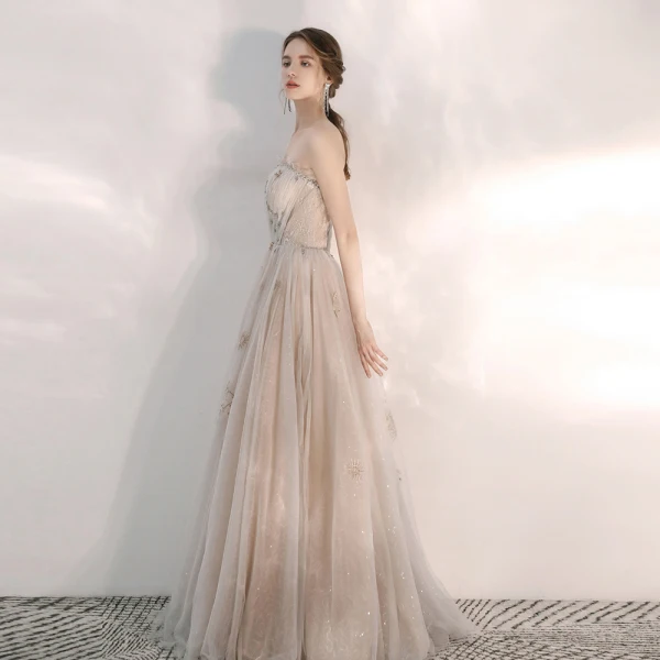 Elegante Champagner Abendkleider 2020 A Linie Bandeau Ärmellos Pailletten Perlenstickerei Lange Rüschen Rückenfreies Festliche Kleider