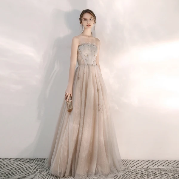 Elegante Champagner Abendkleider 2020 A Linie Bandeau Ärmellos Pailletten Perlenstickerei Lange Rüschen Rückenfreies Festliche Kleider