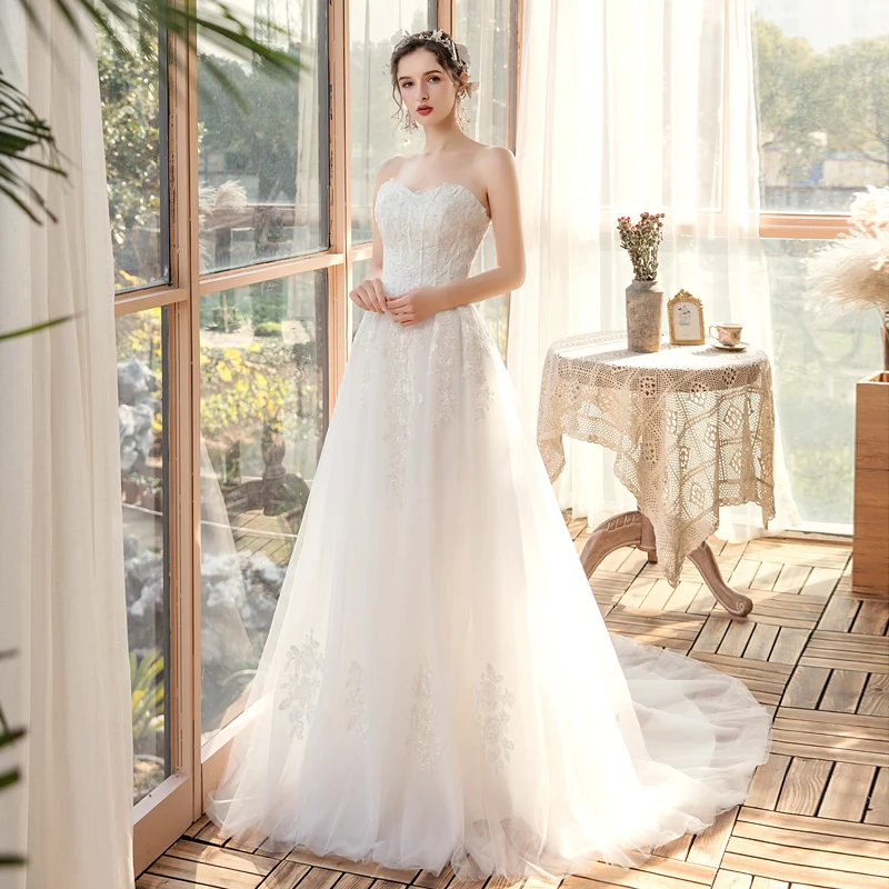 Elegant Hage Utendørs Hvit Brudekjoler 2020 Prinsesse Kjæreste Uten Ermer Ryggløse Appliques Blonder Beading Feie Tog Buste