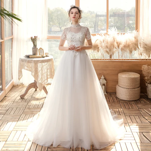 Affordable Outdoor / Garden White Wedding Dresses 2020 A-Line / Princess See-through High Neck Short Sleeve Backless Appliques Sequins Sweep Train