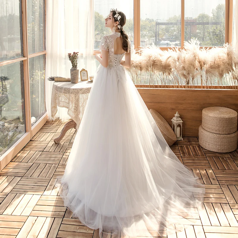 Affordable Outdoor Garden White Wedding Dresses 2020 A Line Princess See  Through High Neck Short Sleeve Backless Appliques Sequins Sweep Train Ruffle