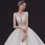 Élégant Champagne La Mariée Robe De Mariée 2020 Robe Boule Col v profond Sans Manches Dos Nu Appliques En Dentelle Perlage Cathedral Train Volants