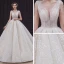 Élégant Champagne La Mariée Robe De Mariée 2020 Robe Boule Col v profond Sans Manches Dos Nu Appliques En Dentelle Perlage Cathedral Train Volants