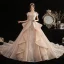Luxe Champagne La Mariée Robe De Mariée 2020 Robe Boule De l'épaule Manches Courtes Dos Nu Glitter Tulle Perlage Appliques En Dentelle Royal Train Volants