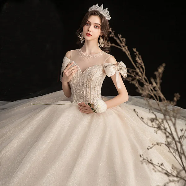 Élégant Champagne Robe De Mariée 2020 Robe Boule Transparentes Encolure Dégagée Noeud Manches Courtes Dos Nu Perlage Gland Glitter Tulle Longue Volants