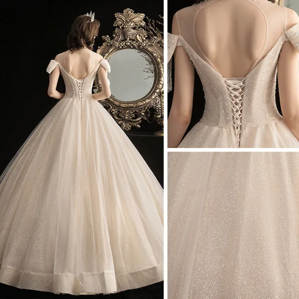 Élégant Champagne Robe De Mariée 2020 Robe Boule Transparentes Encolure Dégagée Noeud Manches Courtes Dos Nu Perlage Gland Glitter Tulle Longue Volants