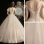 Élégant Champagne Robe De Mariée 2020 Robe Boule Transparentes Encolure Dégagée Noeud Manches Courtes Dos Nu Perlage Gland Glitter Tulle Longue Volants
