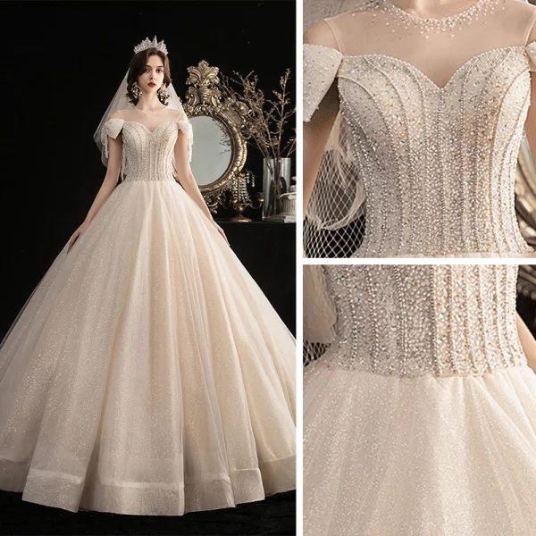 Élégant Champagne Robe De Mariée 2020 Robe Boule Transparentes Encolure Dégagée Noeud Manches Courtes Dos Nu Perlage Gland Glitter Tulle Longue Volants