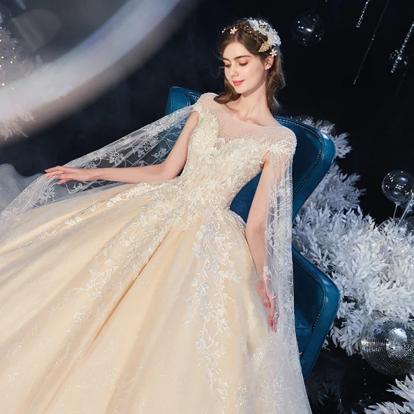 Romantic Champagne Bridal Wedding Dresses 2020 Ball Gown See-through Scoop Neck Short Sleeve Backless Appliques Lace Beading Crystal Cathedral Train Ruffle