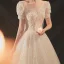 Style Victorien Champagne La Mariée Robe De Mariée 2020 Robe Boule Transparentes Encolure Dégagée Gonflée Manches Courtes Dos Nu Perlage Paillettes Chapel Train Volants