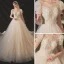 Style Victorien Champagne La Mariée Robe De Mariée 2020 Robe Boule Transparentes Encolure Dégagée Gonflée Manches Courtes Dos Nu Perlage Paillettes Chapel Train Volants