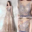 Élégant Champagne Robe De Soirée 2020 Princesse Transparentes Encolure Dégagée Sans Manches Ceinture Appliques En Dentelle Paillettes Train De Balayage Volants Dos Nu Robe De Ceremonie