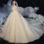 Élégant Champagne La Mariée Robe De Mariée 2020 Robe Boule De l'épaule Manches Courtes Dos Nu Appliques En Dentelle Perlage Glitter Tulle Royal Train Volants