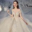 Élégant Champagne La Mariée Robe De Mariée 2020 Robe Boule De l'épaule Manches Courtes Dos Nu Appliques En Dentelle Perlage Glitter Tulle Royal Train Volants