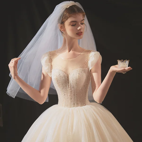 Elegant Champagne Bridal Wedding Dresses 2020 Ball Gown Scoop Neck Sleeveless Backless Glitter Tulle Beading Sequins Cathedral Train Ruffle