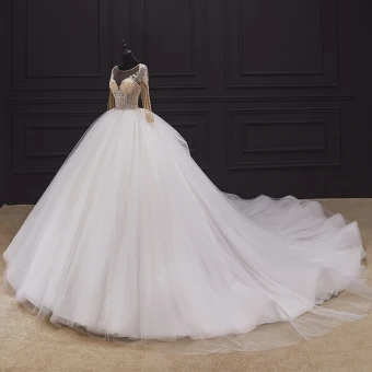 Illusion Ivory Bridal Wedding Dresses 2020 Ball Gown See Through Scoop Neck Long Sleeve Backless Handmade Beading Cathedral Train Ruffle