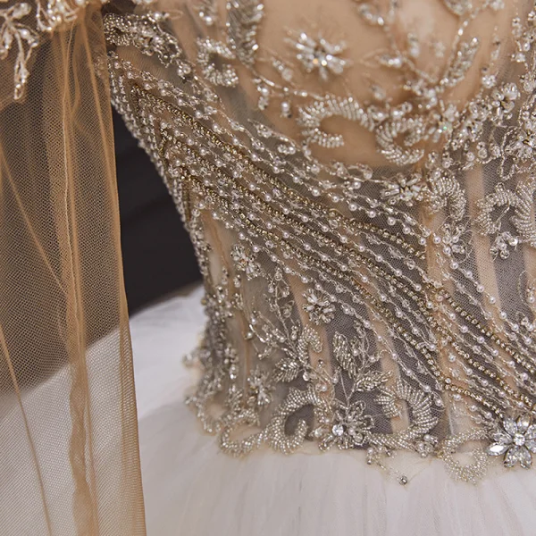 Illusion Ivory Bridal Wedding Dresses 2020 Ball Gown See-through Scoop Neck Long Sleeve Backless Handmade Beading Cathedral Train Ruffle