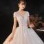 Romantique Champagne La Mariée Robe De Mariée 2020 Robe Boule Transparentes Col v profond Manches Courtes Dos Nu Appliques En Dentelle Perlage Étoile Paillettes Glitter Tulle Cathedral Train Volants