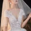 Romantique Champagne La Mariée Robe De Mariée 2020 Robe Boule Transparentes Col v profond Manches Courtes Dos Nu Appliques En Dentelle Perlage Étoile Paillettes Glitter Tulle Cathedral Train Volants