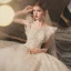 Chic / Belle Champagne La Mariée Robe De Mariée 2020 Robe Boule Transparentes Encolure Dégagée Sans Manches Dos Nu Appliques En Dentelle Perlage Glitter Tulle Chapel Train Volants
