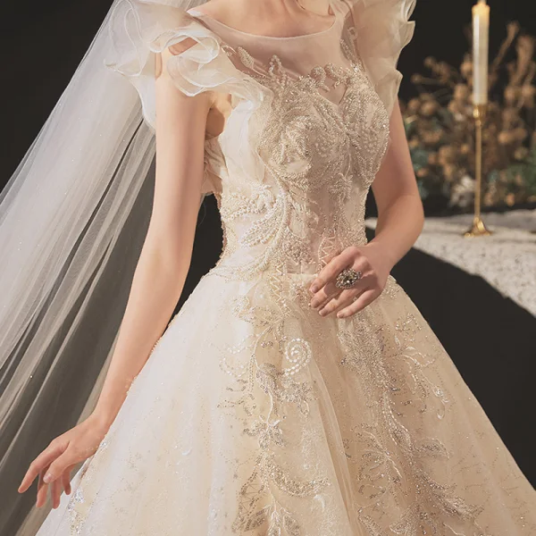Chic / Belle Champagne La Mariée Robe De Mariée 2020 Robe Boule Transparentes Encolure Dégagée Sans Manches Dos Nu Appliques En Dentelle Perlage Glitter Tulle Chapel Train Volants