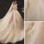 Chic / Belle Champagne La Mariée Robe De Mariée 2020 Robe Boule Transparentes Encolure Dégagée Sans Manches Dos Nu Appliques En Dentelle Perlage Glitter Tulle Chapel Train Volants