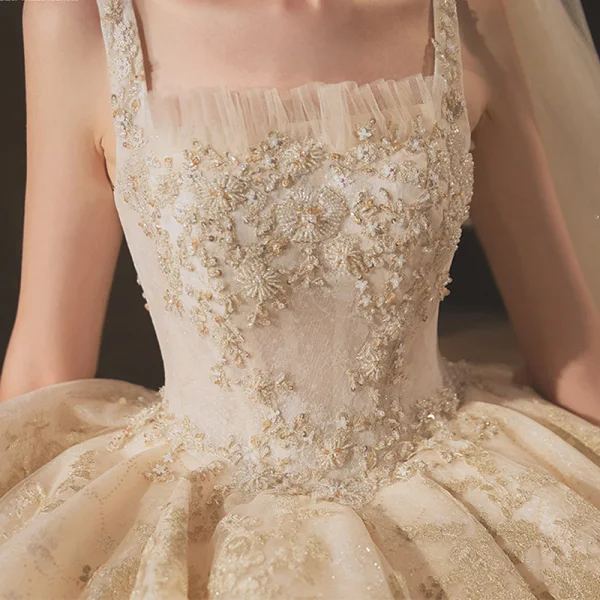 Classic Champagne Bridal Wedding Dresses 2020 Ball Gown Shoulders Sleeveless Backless Appliques Beading Glitter Tulle Cathedral Train Ruffle