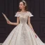 Vintage / Originale Champagne La Mariée Robe De Mariée 2020 Robe Boule Transparentes Encolure Carrée Manches Courtes Dos Nu Perlage Appliques En Dentelle Paillettes Glitter Tulle Cathedral Train Volants