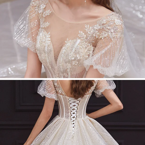 Style Victorien Champagne La Mariée Robe De Mariée 2020 Robe Boule Transparentes Encolure Dégagée Gonflée Manches Courtes Dos Nu Perlage Appliques En Dentelle Paillettes Cathedral Train Volants