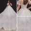 Style Victorien Champagne La Mariée Robe De Mariée 2020 Robe Boule Transparentes Encolure Dégagée Gonflée Manches Courtes Dos Nu Perlage Appliques En Dentelle Paillettes Cathedral Train Volants