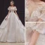 Style Victorien Champagne La Mariée Robe De Mariée 2020 Robe Boule Transparentes Encolure Dégagée Gonflée Manches Courtes Dos Nu Perlage Appliques En Dentelle Paillettes Cathedral Train Volants