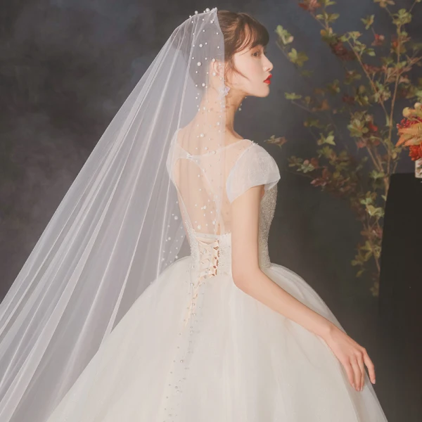 High-end Champagne Bridal Wedding Dresses 2020 Ball Gown See-through Scoop Neck Sleeveless Backless Beading Sequins Glitter Tulle Cathedral Train Ruffle