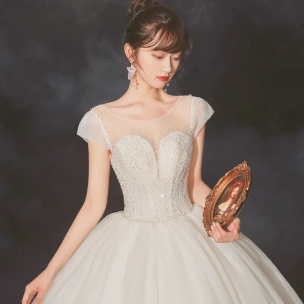 High-end Champagne Bridal Wedding Dresses 2020 Ball Gown See-through Scoop Neck Sleeveless Backless Beading Sequins Glitter Tulle Cathedral Train Ruffle