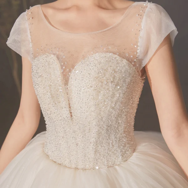 High-end Champagne Bridal Wedding Dresses 2020 Ball Gown See-through Scoop Neck Sleeveless Backless Beading Sequins Glitter Tulle Cathedral Train Ruffle