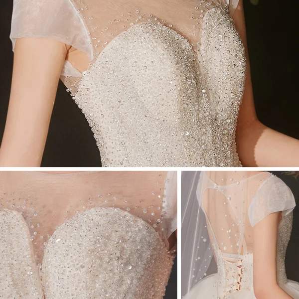 High-end Champagne Bridal Wedding Dresses 2020 Ball Gown See-through Scoop Neck Sleeveless Backless Beading Sequins Glitter Tulle Cathedral Train Ruffle
