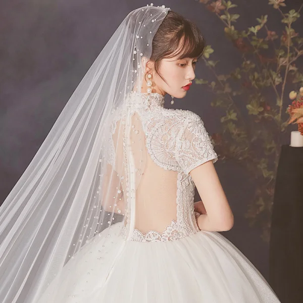 Vintage / Retro Ivory See-through Wedding Dresses 2020 Ball Gown High Neck Short Sleeve Appliques Lace Beading Pearl Cathedral Train Ruffle