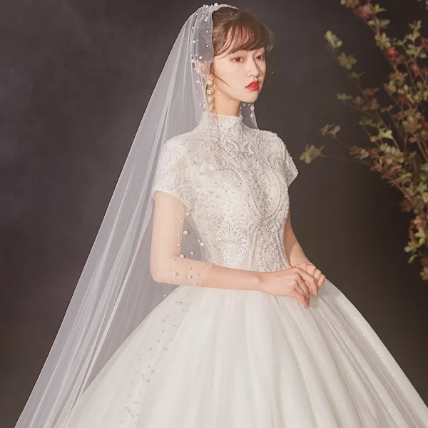 Vintage / Retro Ivory See-through Wedding Dresses 2020 Ball Gown High Neck Short Sleeve Appliques Lace Beading Pearl Cathedral Train Ruffle