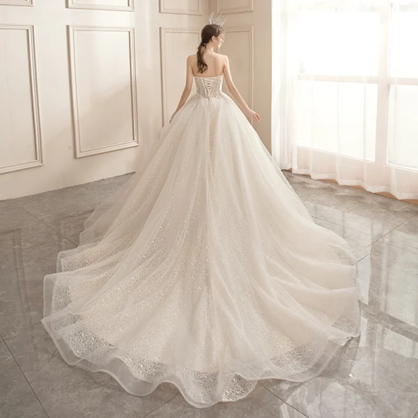 Affordable Champagne Bridal Wedding Dresses 2020 Ball Gown Strapless Sleeveless Backless Appliques Lace Beading Glitter Tulle Chapel Train Ruffle