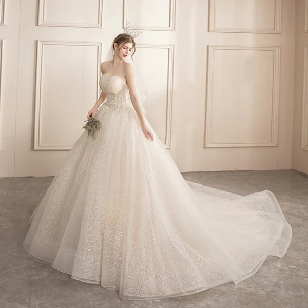 Affordable Champagne Bridal Wedding Dresses 2020 Ball Gown Strapless Sleeveless Backless Appliques Lace Beading Glitter Tulle Chapel Train Ruffle
