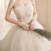 Affordable Champagne Bridal Wedding Dresses 2020 Ball Gown Strapless Sleeveless Backless Appliques Lace Beading Glitter Tulle Chapel Train Ruffle
