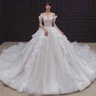 Romantic Champagne Bridal Wedding Dresses 2020 Ball Gown Off The Shoulder Bow Short Sleeve Backless Glitter Tulle Cathedral Train Ruffle