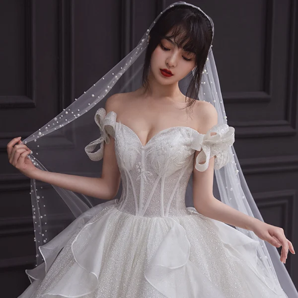Romantic Champagne Bridal Wedding Dresses 2020 Ball Gown Off-The-Shoulder Bow Short Sleeve Backless Glitter Tulle Cathedral Train Ruffle