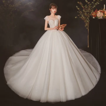 High End Elfenben Genomskinliga Brud Bröllopsklänningar 2020 Balklänning Urringning Korta Ärm Halterneck Beading Glittriga Glitter Tyll Cathedral Train Ruffle