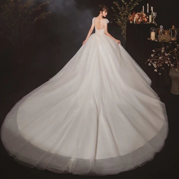 High-end Ivory See-through Bridal Wedding Dresses 2020 Ball Gown Scoop Neck Short Sleeve Backless Beading Glitter Tulle Cathedral Train Ruffle