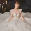 High End Ivory / Creme Durchsichtige Hochzeits Brautkleider / Hochzeitskleider 2020 Ballkleid Rundhalsausschnitt Kurze Ärmel Rückenfreies Perlenstickerei Glanz Tülle Kathedrale Schleppe Rüschen