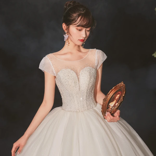 High-end Ivory See-through Bridal Wedding Dresses 2020 Ball Gown Scoop Neck Short Sleeve Backless Beading Glitter Tulle Cathedral Train Ruffle