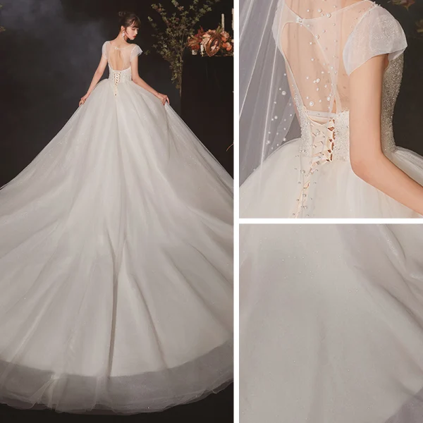 High-end Ivory See-through Bridal Wedding Dresses 2020 Ball Gown Scoop Neck Short Sleeve Backless Beading Glitter Tulle Cathedral Train Ruffle