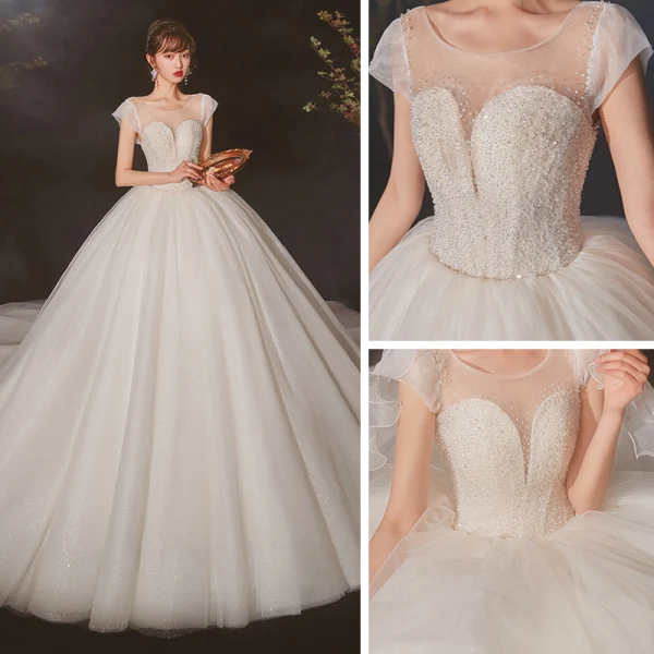 High-end Ivory See-through Bridal Wedding Dresses 2020 Ball Gown Scoop Neck Short Sleeve Backless Beading Glitter Tulle Cathedral Train Ruffle